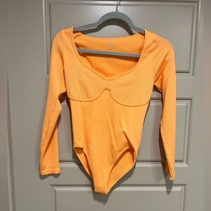 Orange ribbed bodysuit